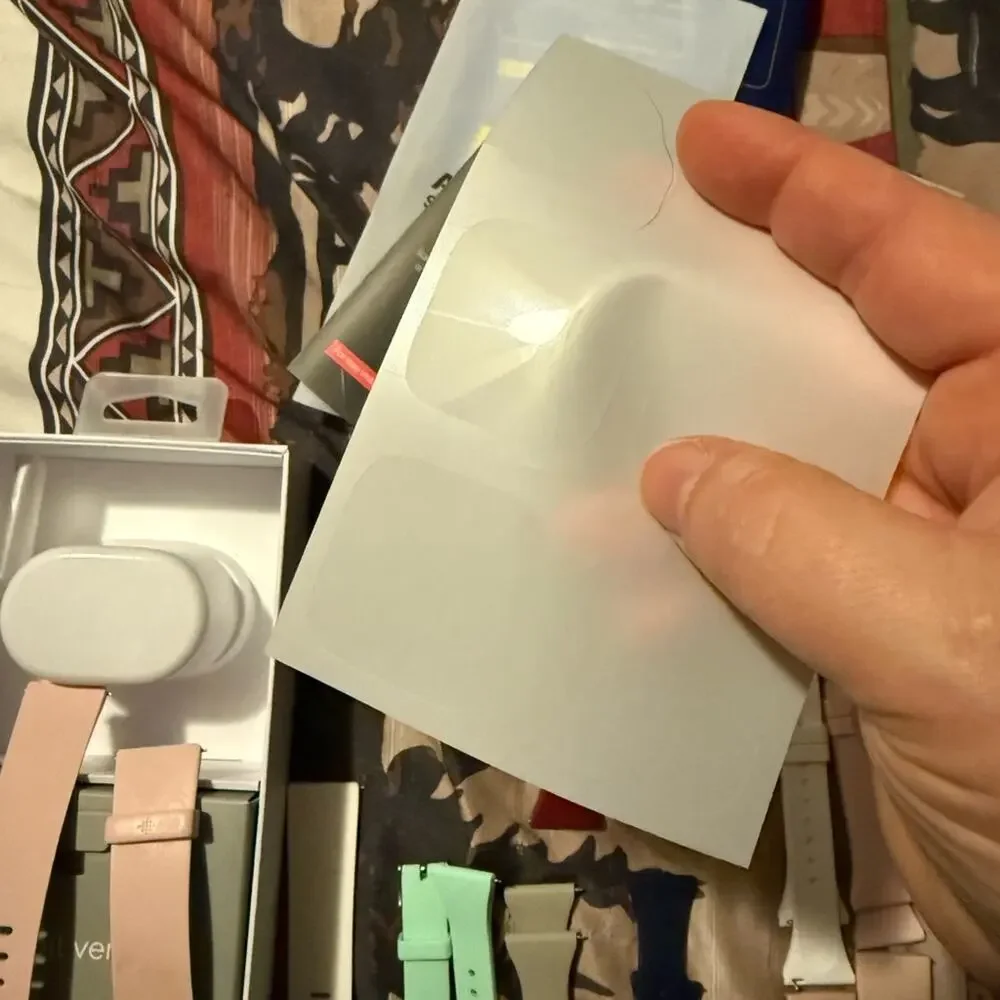Pair of Fitbit Versa and Fitbit Versa 2, 2 chargers, 2 screen protectors, bands